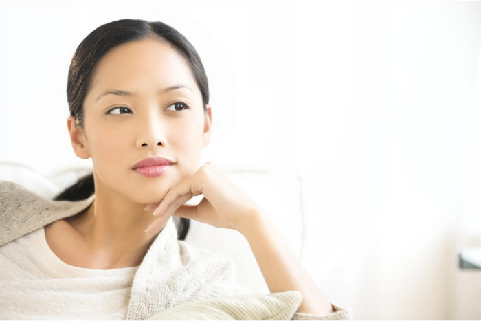 Woman With Beautiful Skin Pondering