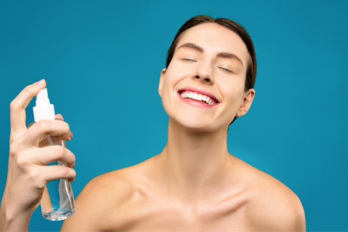 Woman Spraying Facial Mist On Skin Source Shiny Diamond Pexels